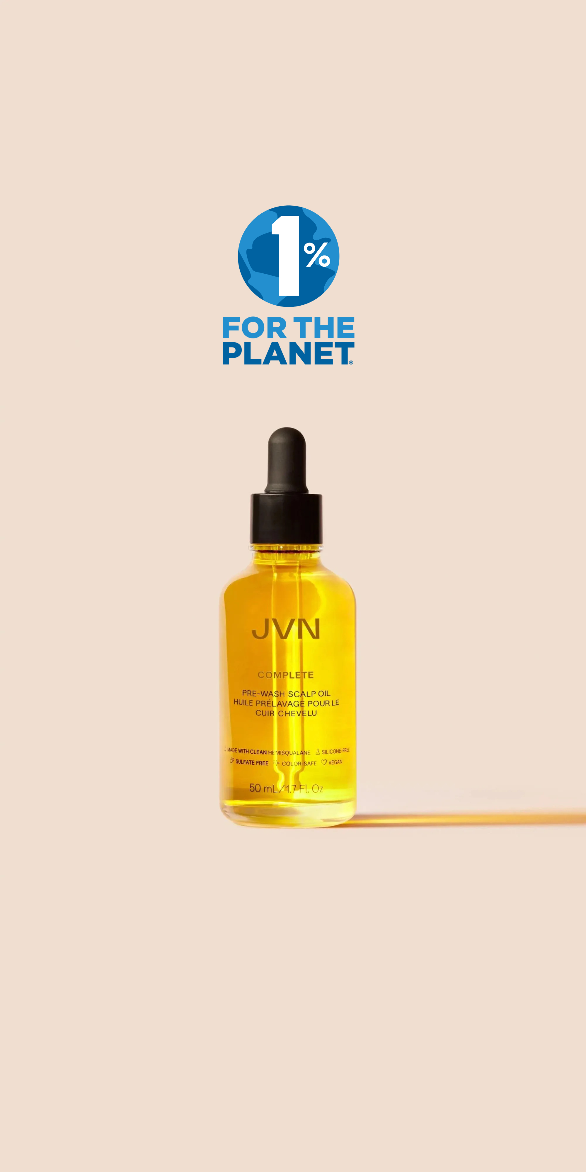 a bottle of JVN hair pre wash scalp oil with the 1% logo above it 